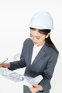 女性建筑工程师看图纸背景图片