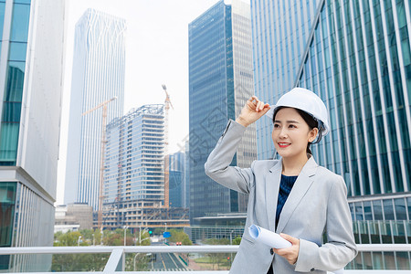 女性建筑工程师美女拿平板电脑背景图片