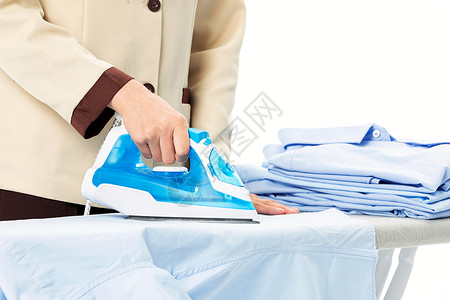 家政服务女性熨烫衣服背景图片