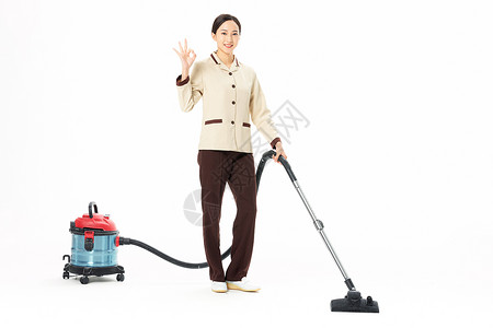 家政服务女性使用吸尘器背景图片