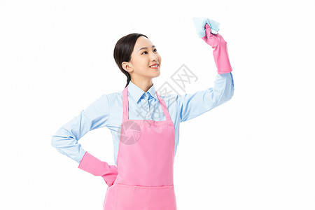 家政服务保洁员拿着抹布擦玻璃背景图片