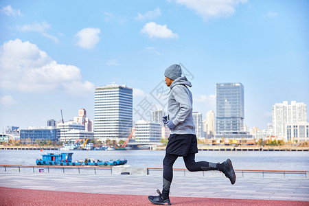 男青年户外跑步背影背景图片