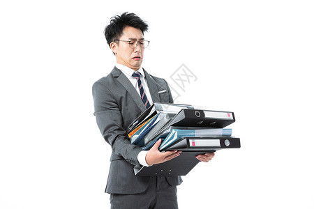 抱文件商务男性抱着许多文件背景