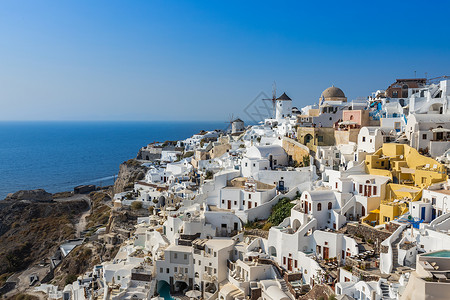 欧洲希腊著名圣托里尼日落小镇伊亚小镇风光背景图片