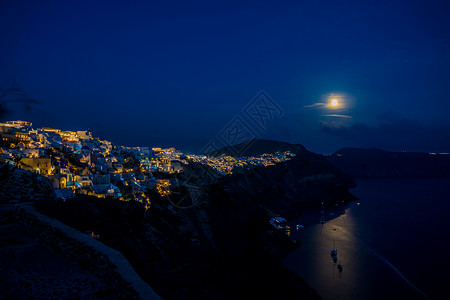 圣托里尼夜景圣托里尼半岛与月同明背景