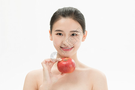 苹果美女健康活力美妆少女手拿苹果背景