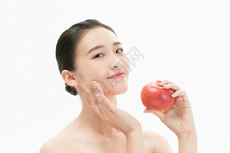 健康活力美妆少女手拿苹果高清图片