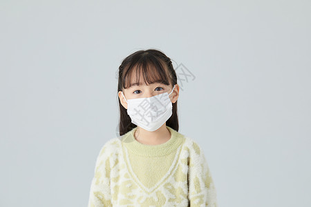 预防肺炎流行病小女孩戴着口罩背景