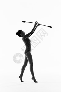 年轻女性艺术体操棒操动作展示背景图片
