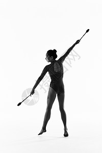 羽毛球扣杀剪影年轻女性艺术体操棒操动作展示背景