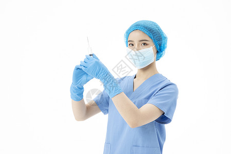 女性医生手术服拿着针筒打针图片