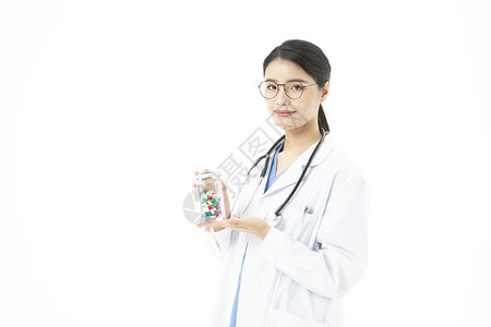 女性医生拿着药品胶囊高清图片