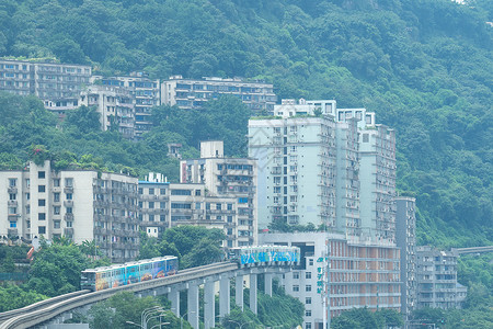 地铁房地产展板重庆网红旅游地标穿过楼宇的李子坝地铁站背景