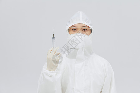护士医用注射器穿防护服手持医用针筒的医护人员背景