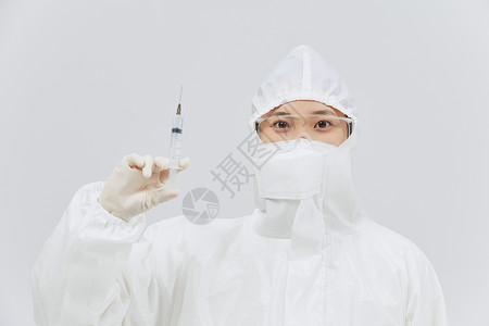 护士医用注射器穿防护服手持医用针筒的医护人员背景