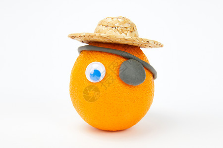 小丑帽子和眼镜愚人节创意水果橙子背景