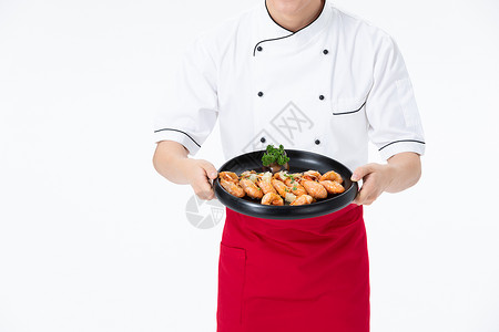 厨师手捧基围虾菜品特写背景图片