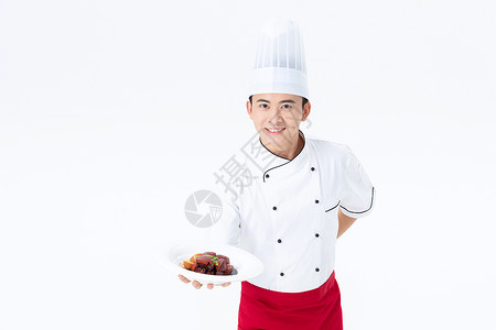 厨师手捧红烧肉菜品图片