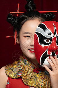 中国风潮流儿童拿着京剧面具背景图片