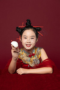 中国风潮流儿童拿着筷子吃包子背景图片