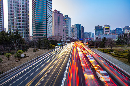 延时退休青岛城市主干道汽车光轨延时背景