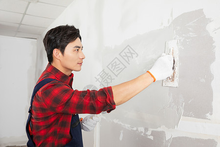 红色劳动节展板装修工人涂擦墙腻子刷墙背景