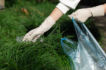 城市园丁公益活动志愿者拾捡垃圾特写背景