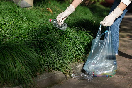 城市园丁公益活动志愿者拾捡垃圾特写背景