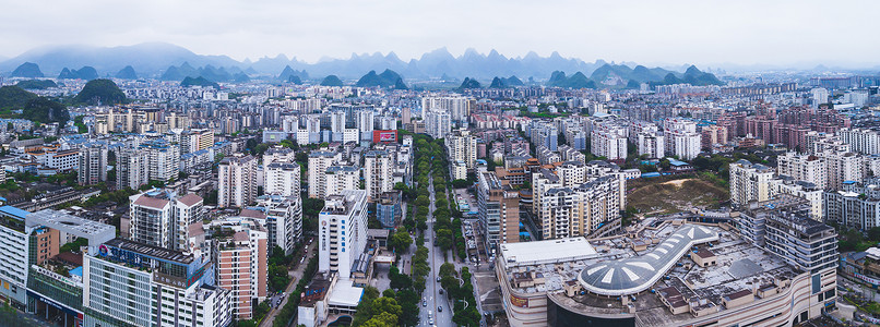 航拍桂林拼接图城市楼宇楼房建筑群山脉背景图片