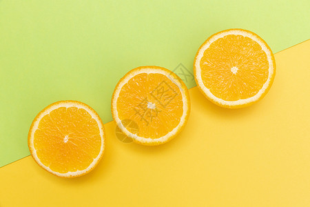 创意戴帽子的水果橙子创意橙子切片组合背景