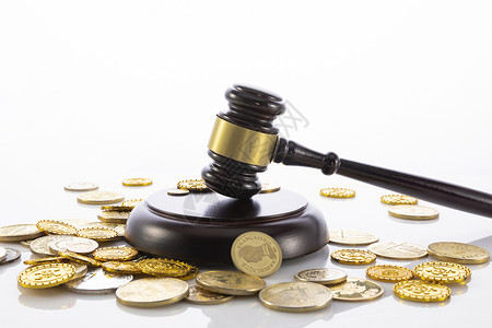 经济法律法官法槌和金币背景
