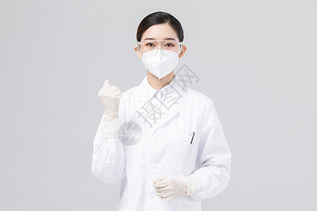 佩戴口罩与护目镜加油的女医生高清图片