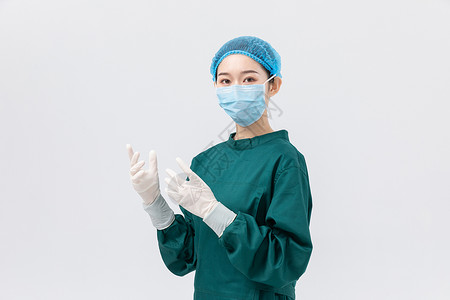 穿着手术服在文件夹上签字的医生穿手术服的外科医生形象背景