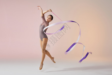 体操女孩艺术体操带操动作展示背景