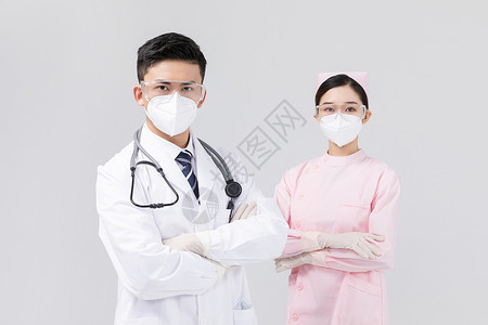 责任与使命佩戴口罩与护目镜的医生与护士背景