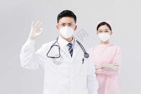 责任与使命佩戴口罩与护目镜的医生与护士背景