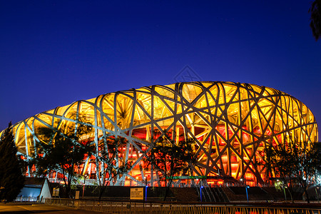 北京地标夜景北京国家体育场鸟巢夜景灯光背景