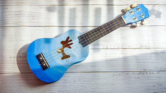 蓝色吉他手工制作乐器尤克里里背景
