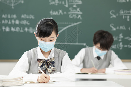 戴口罩的学生戴口罩上课的初中生背景
