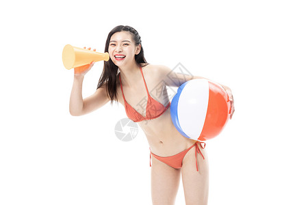 夏日泳装女性拿着沙滩排球图片