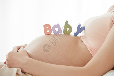 女人怀孕孕妇躺在床上背景