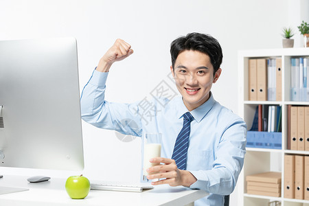 电脑健康青年商务男性办公室喝牛奶背景