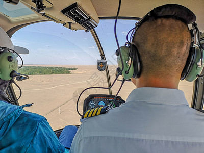 私人直升机直升机驾驶员背影背景