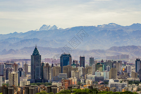 乌鲁木齐城市新疆乌鲁木齐雪山天际线背景