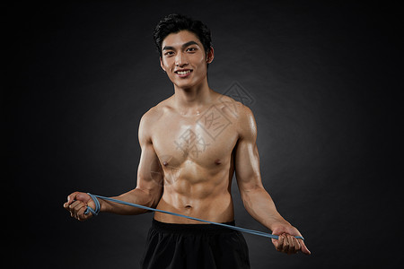 运动男性拉力绳训练背景图片