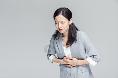 亚健康商务女性腹部疼痛图片