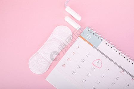 粉色日历粉色背景上的女性卫生用品背景