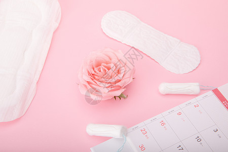粉色日历粉色背景上的女性卫生用品背景