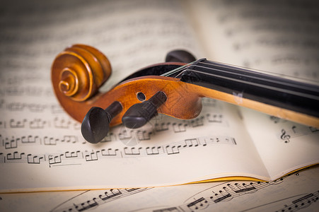 小提琴学习班复古小提琴与乐谱背景