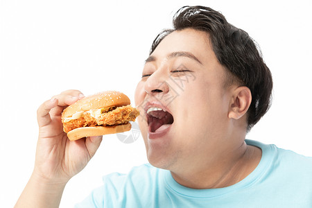 肥胖男士开心吃汉堡背景图片